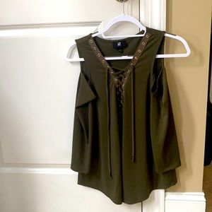 IZ Byer olive green long sleeve blouse with cut outs for shoulder.